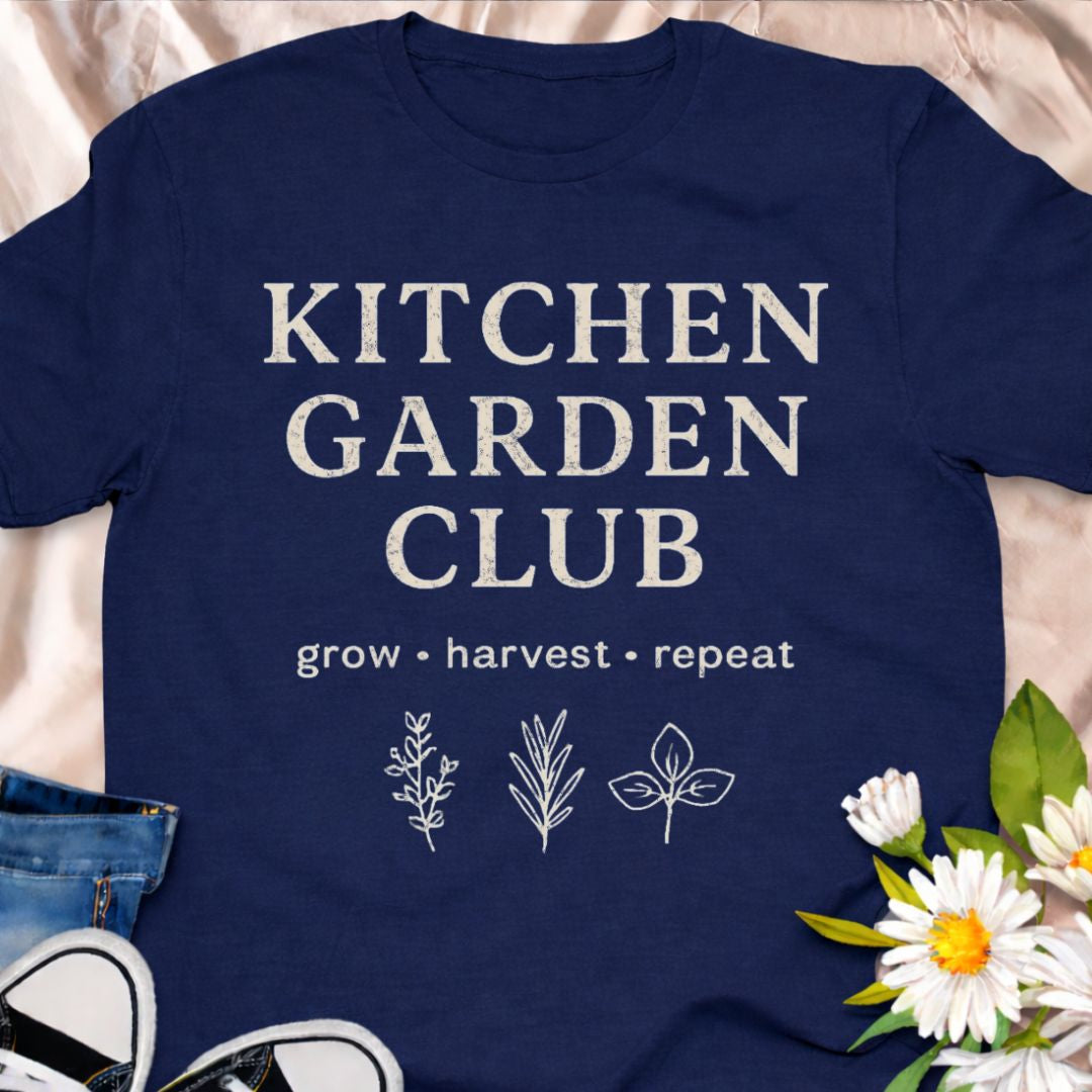 “Kitchen Garden Club – Grow • Harvest • Repeat” t-shirt for home growers and vegetable gardeners. A rustic botanical graphic tee perfect for herb lovers, backyard gardeners, and garden-to-table enthusiasts.