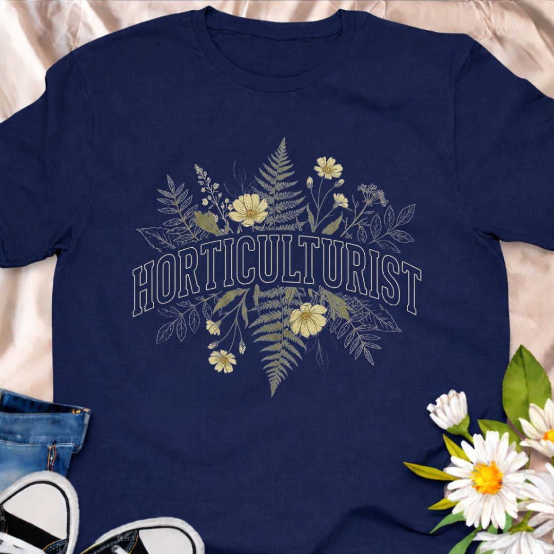 Celebrate your love of plants with this Horticulturist shirt featuring a vintage-inspired botanical design with delicate florals and foliage. Perfect for gardeners, plant lovers, and flower enthusiasts, this soft unisex tee makes a thoughtful gift for birthdays, Mother’s Day, Father's Day or everyday garden pride.