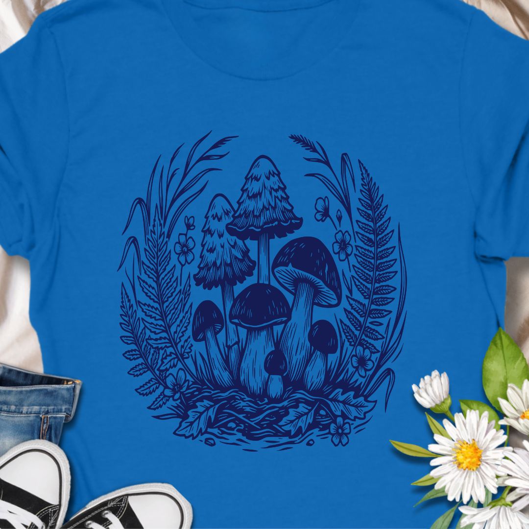 Beautiful woodland mushroom t-shirt featuring detailed forest fungi surrounded by ferns and wild plants in a botanical illustration style. Perfect for mushroom lovers, nature enthusiasts, gardeners, and fans of cottage core forest aesthetics.