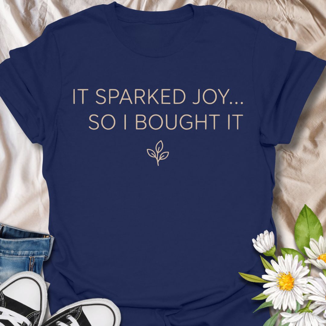 Funny plant lover t-shirt featuring “It Sparked Joy… So I Bought It.” Perfect for plant parents, houseplant collectors, and anyone who can’t resist one more plant. A clean, minimalist botanical tee for everyday wear or gifting.