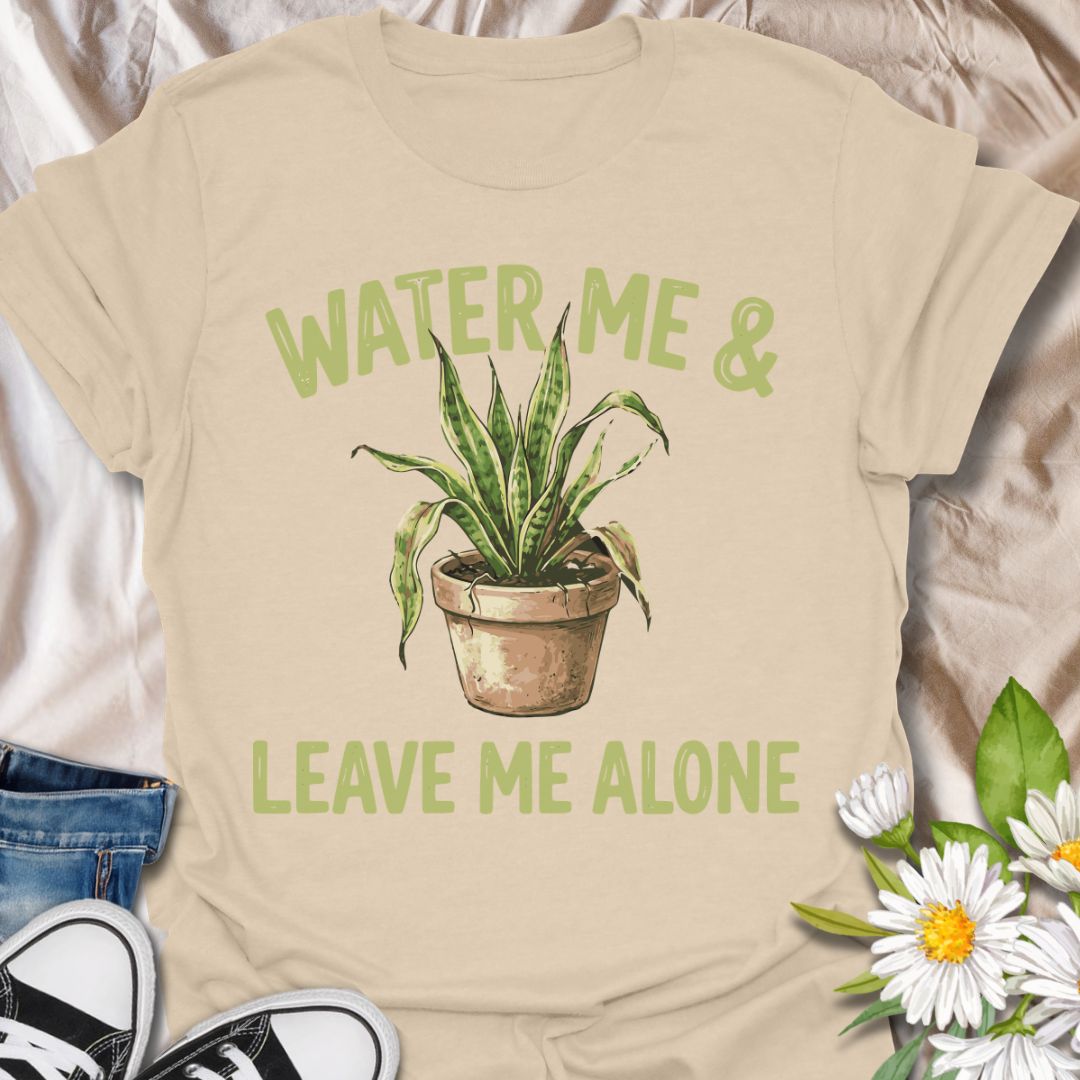 Funny plant lover t-shirt featuring “Water Me & Leave Me Alone” with a houseplant graphic. Perfect for plant parents, introverts, and anyone who loves plants and personal space. A relatable botanical tee for everyday wear or gifting.