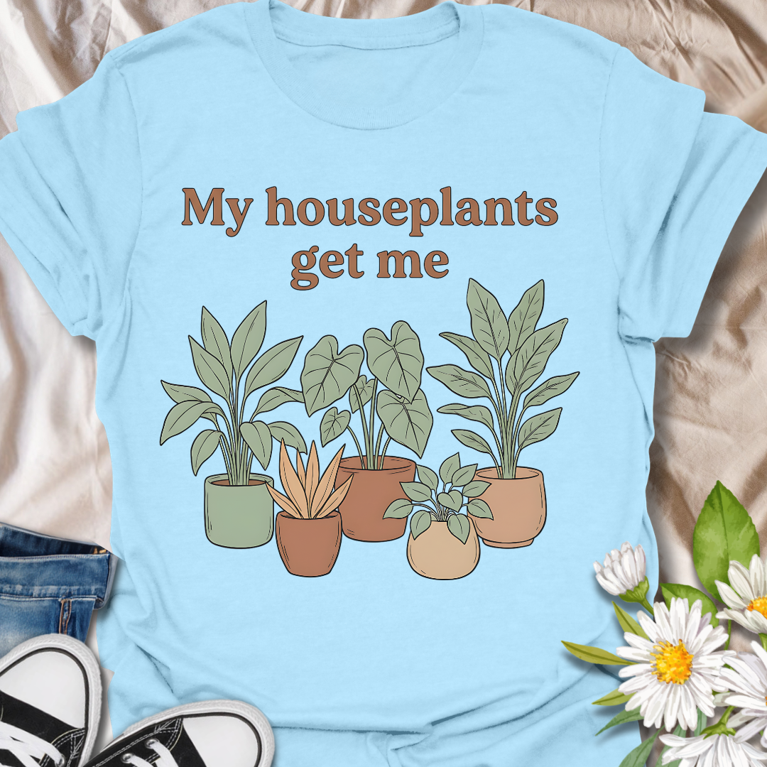 Funny houseplant lover t-shirt featuring leafy potted plants and the phrase “My houseplants get me”. A cozy botanical graphic tee for plant parents, indoor plant fans, and anyone obsessed with houseplants.