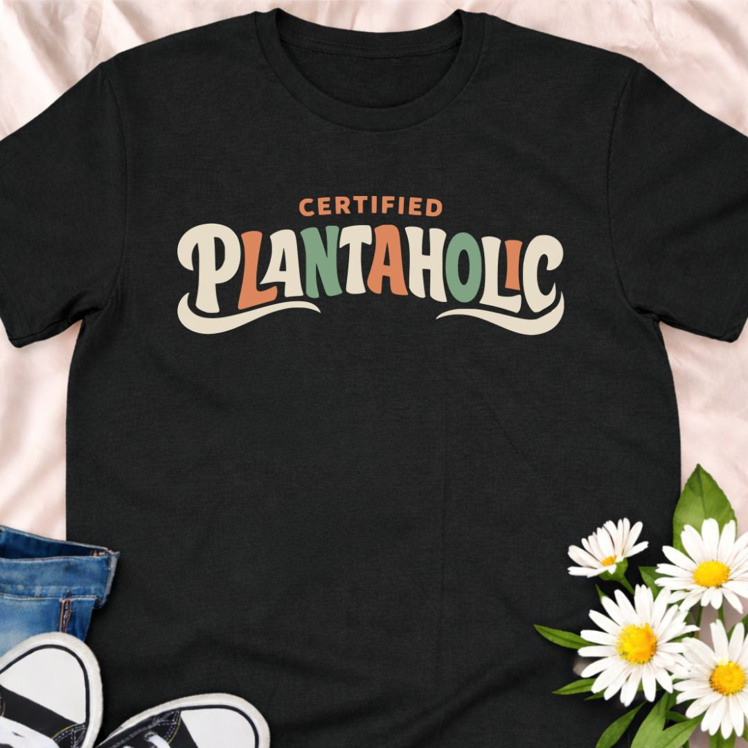 Funny plant lover t-shirt featuring the phrase “Certified Plantaholic” in a retro botanical style. A playful houseplant tee for plant parents, indoor gardeners, and anyone proudly obsessed with plants.