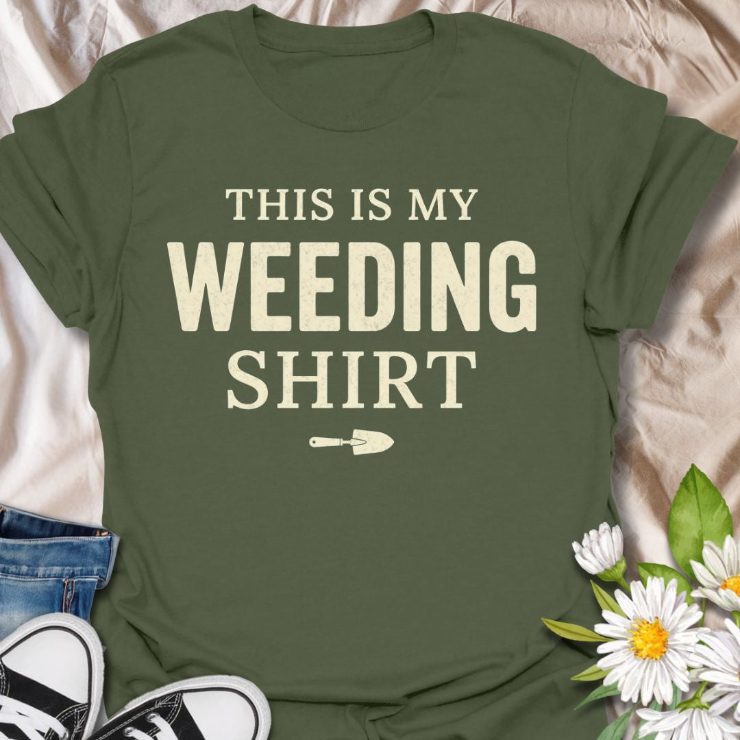 Funny gardening t-shirt featuring the phrase “This Is My Weeding Shirt.” A simple, bold tee for gardeners, plant lovers, and backyard growers who know weeding is just part of the job and somehow still part of the fun.