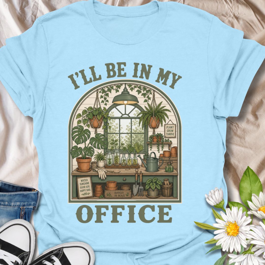 This I’ll Be In My Office t-shirt is made for plant lovers who would rather be surrounded by houseplants, propagation jars, watering cans, and greenhouse calm. The cozy illustrated design features a charming indoor plant room filled with hanging baskets, leafy plants, garden tools, and botanical details for a peaceful plant-parent feel. Perfect for plant moms, houseplant collectors, gardeners, greenhouse lovers, propagation fans, and anyone whose happy place is their own leafy little office.