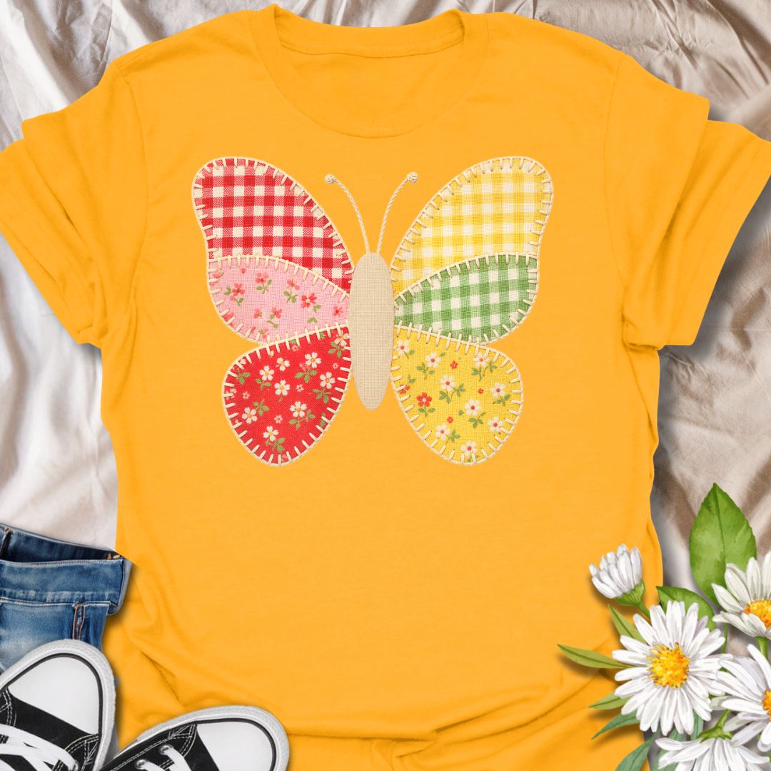 This faux Patchwork Butterfly t-shirt is made for nature lovers who enjoy bright, cheerful designs with a look of being handmade all achieved through printing methods. Featuring a colorful butterfly made from gingham and floral patchwork-style panels with faux stitched details, this design has a sweet cottagecore look that feels playful, crafty, and full of charm. Perfect for butterfly lovers, flower fans, gardeners, cottagecore style lovers, sewing fans, and anyone who loves soft, whimsical nature-in