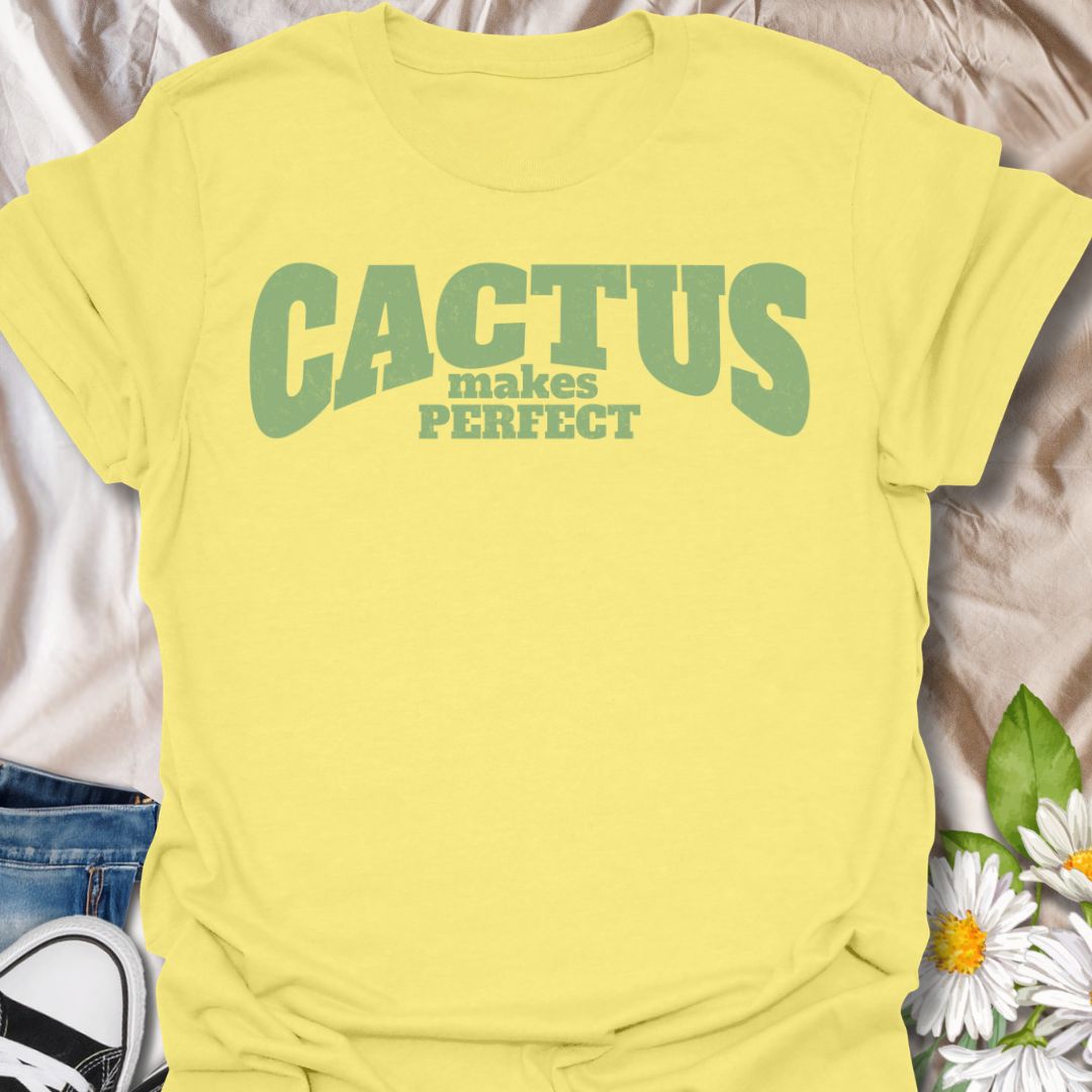 This Cactus Makes Perfect t-shirt is made for plant lovers who have a soft spot for prickly plants, desert greenery, and cute plant puns. Featuring bold vintage-style text in soft green with the phrase Cactus Makes Perfect, this simple design has a clean, funny botanical feel that is easy to wear every day. Perfect for cactus lovers, succulent fans, plant moms, plant dads, houseplant collectors, and anyone who thinks a little prickly personality is part of the charm.