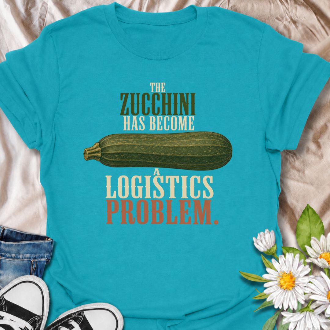 A funny gardening T-shirt for anyone who planted zucchini and then discovered just how productive one plant can be. The phrase “The Zucchini Has Become a Logistics Problem” perfectly captures that point in summer when the harvest starts taking over the kitchen. Featuring an oversized vintage-style zucchini, this design is ideal for vegetable gardeners, backyard growers, and anyone familiar with a bumper crop. It makes a great gift for gardeners who are forever giving away extra squash to friends and neighbo