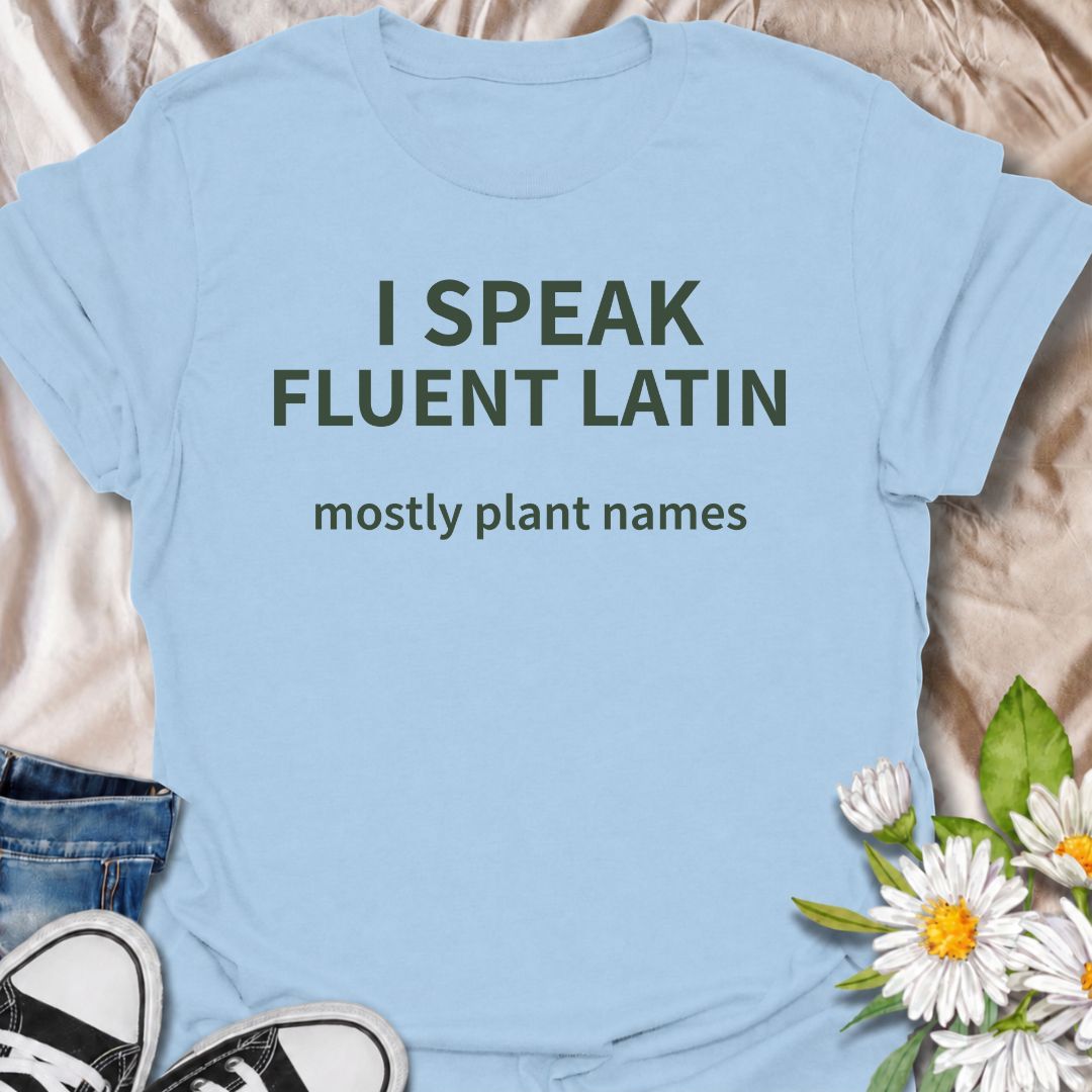A funny plant T-shirt for gardeners who know more botanical Latin than they ever expected to learn. The phrase “I Speak Fluent Latin — Mostly Plant Names” delivers clever, niche humor for plant lovers, gardeners, and anyone who casually drops scientific plant names into conversation. Its clean typography keeps the design simple, readable, and easy to wear. It makes a great gift for horticulture fans, houseplant collectors, flower gardeners, and serious plant nerds. Perfect for nursery trips, garden centers,