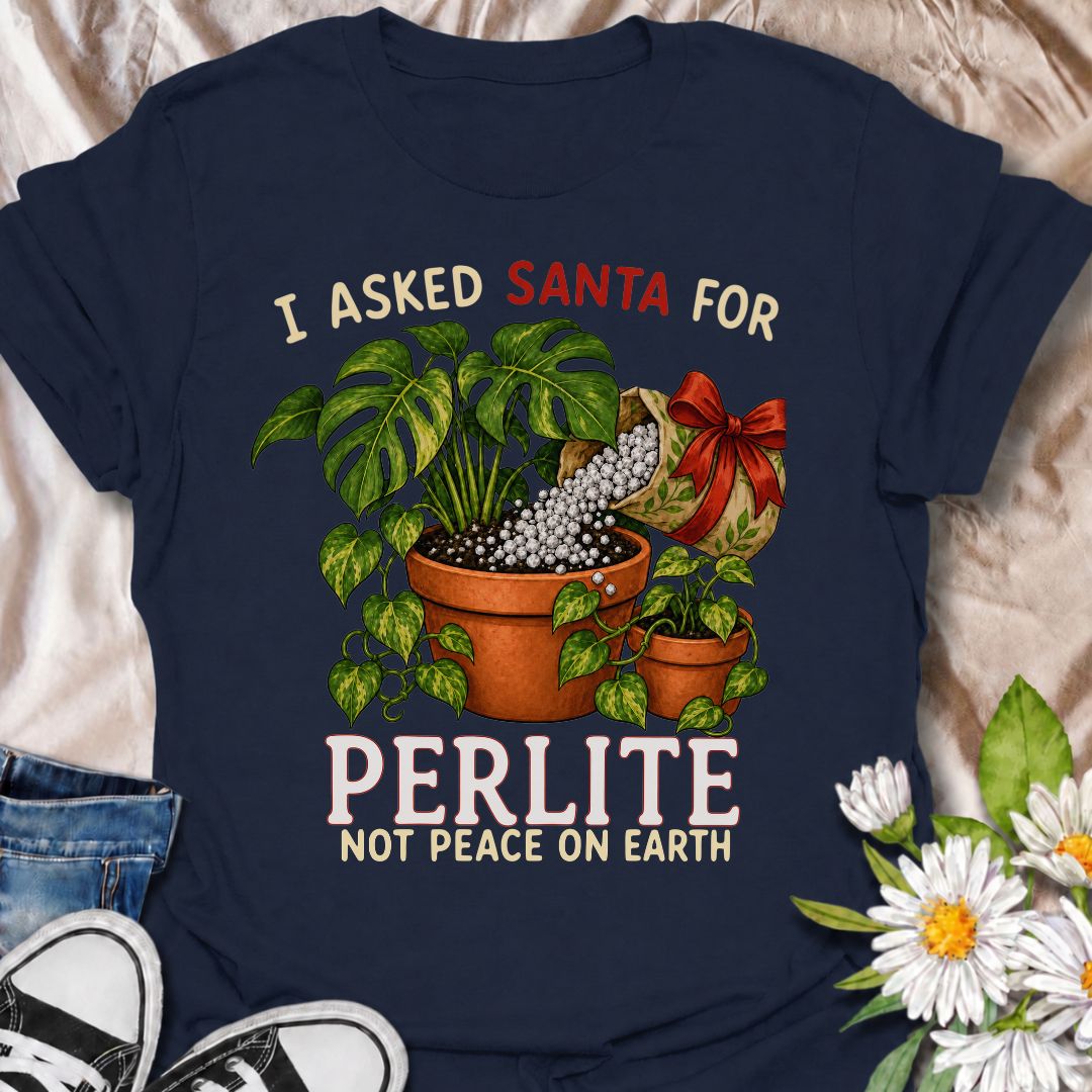 A funny Christmas plant T-shirt for houseplant lovers who would rather find gardening supplies under the tree than another ordinary gift. The phrase “I Asked Santa for Perlite, Not Peace on Earth” pairs with lush potted plants and a festive bag of perlite for niche holiday plant humor. It is perfect for plant parents, indoor gardeners, propagation fans, and anyone who takes their potting mix very seriously. The Christmas colors and botanical artwork make it festive without losing the plant-lover personality