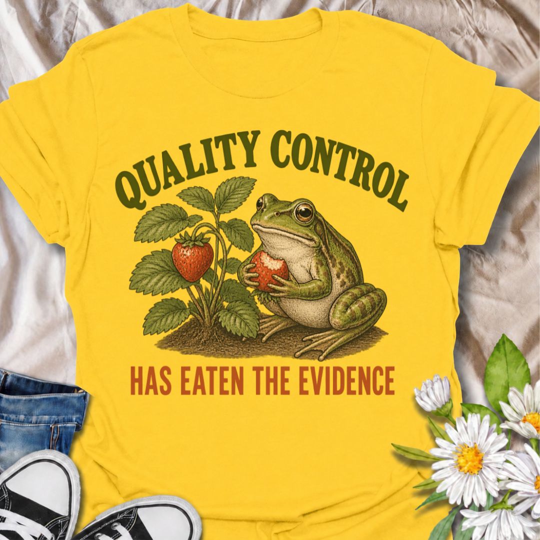 A funny gardening T-shirt for anyone who knows the garden’s unofficial quality-control inspector usually gets there first. The phrase “Quality Control Has Eaten the Evidence” pairs with a smug frog and strawberry plant for a playful, relatable take on garden wildlife. It is perfect for strawberry growers, backyard gardeners, frog lovers, and anyone who has lost part of the harvest before picking time. The vintage-style illustration gives the design plenty of character while keeping the joke clear and easy t
