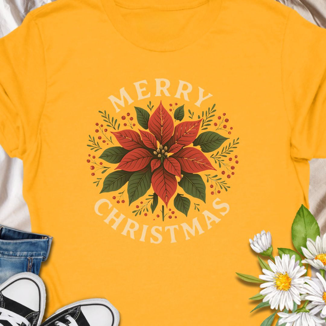 Botanical tee that carries a quietly festive spirit — a poinsettia framed by warm "Merry Christmas" lettering. Subtle vintage tones in the print give the design a homey, handmade feel that blends with cozy kitchens, neighborhood caroling, and quiet evenings by twinkling lights. Wear it while wrapping gifts, making cocoa, or hosting a laid-back family dinner