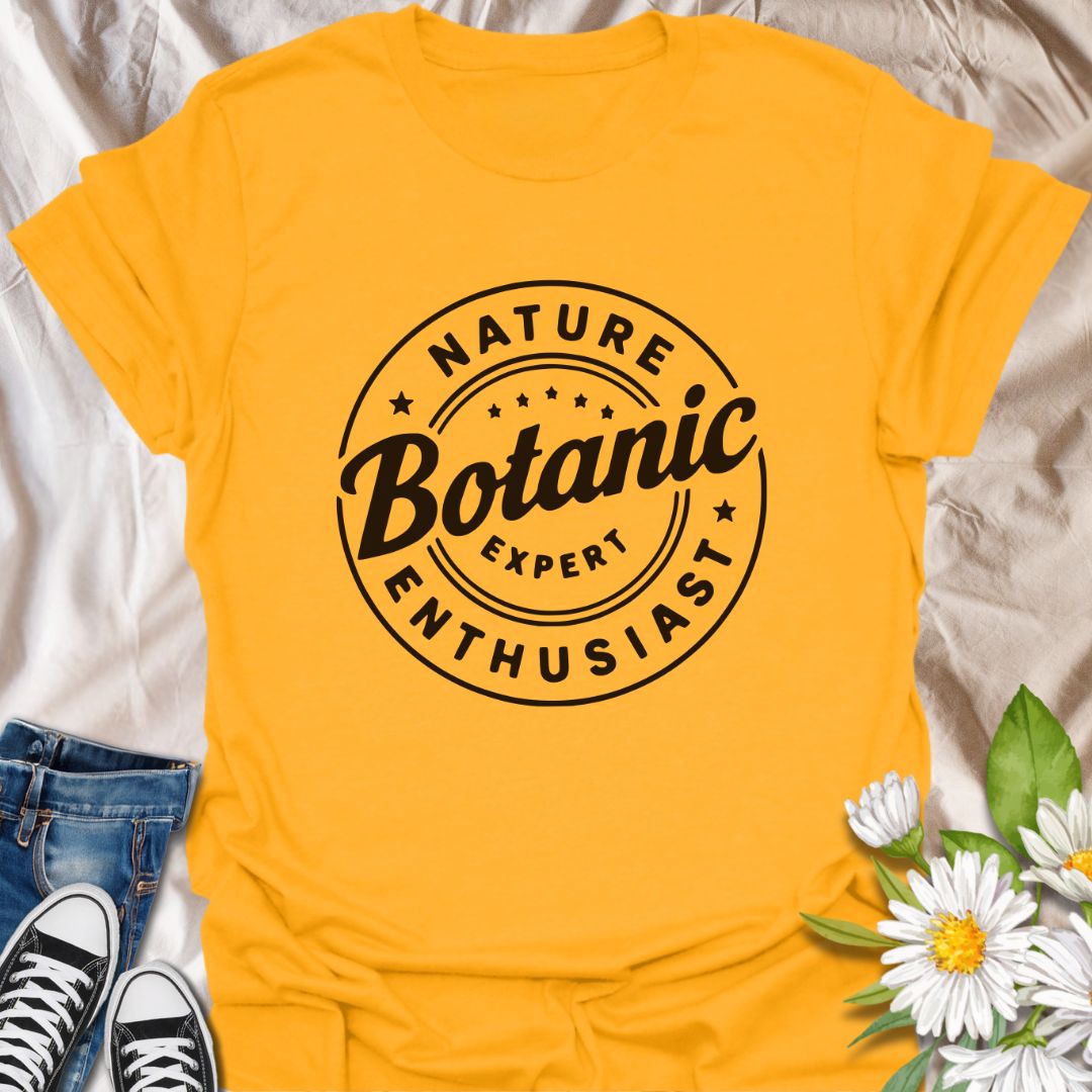 Show off your love for plants with this bold graphic t-shirt featuring the phrase "Nature Expert Botanic Enthusiast." This is in either white or black text, dependant on the color choice. This Tee is Perfect for gardeners, plant parents, and anyone passionate about botany, nature, and green living.