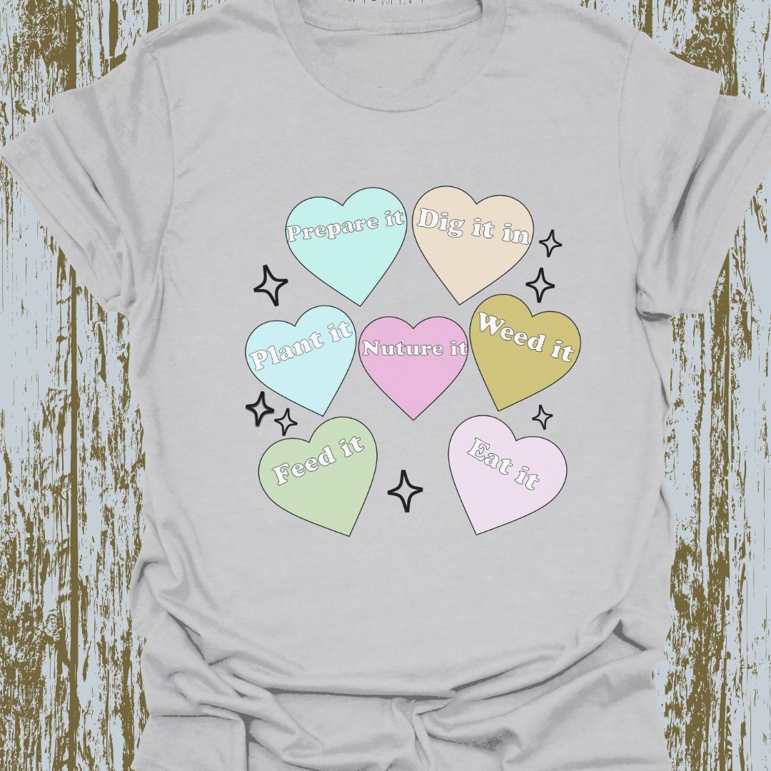 Hearts with plant-related text in pastel colors on a light grey T-shirt
