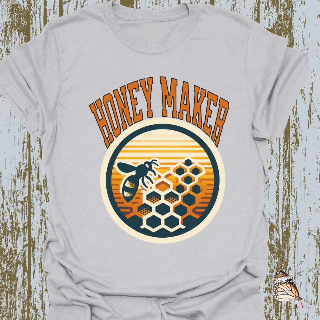 Ice Grey T-shirt featuring a circular design with a bee and honeycomb, accompanied by the text "Honey Maker" in orange.