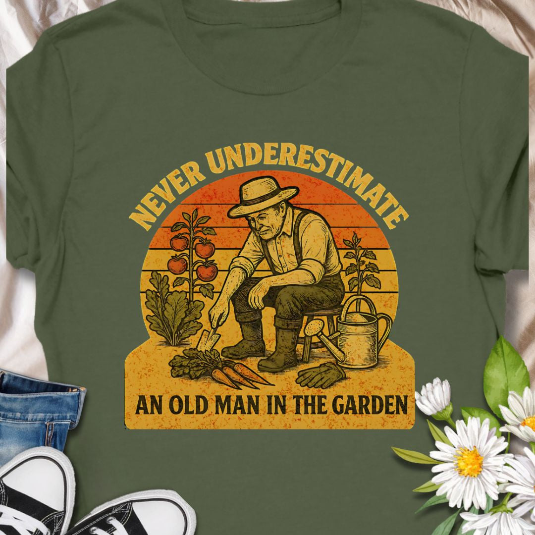 Celebrate gardening wisdom with this “Never Underestimate an Old Man in the Garden” tee featuring a retro-style illustration of a seasoned gardener harvesting his crops. A funny and heart warming shirt for grandpas, dads, or any experienced grower who takes pride in their garden. Makes a thoughtful gift for Father’s Day or retirement.