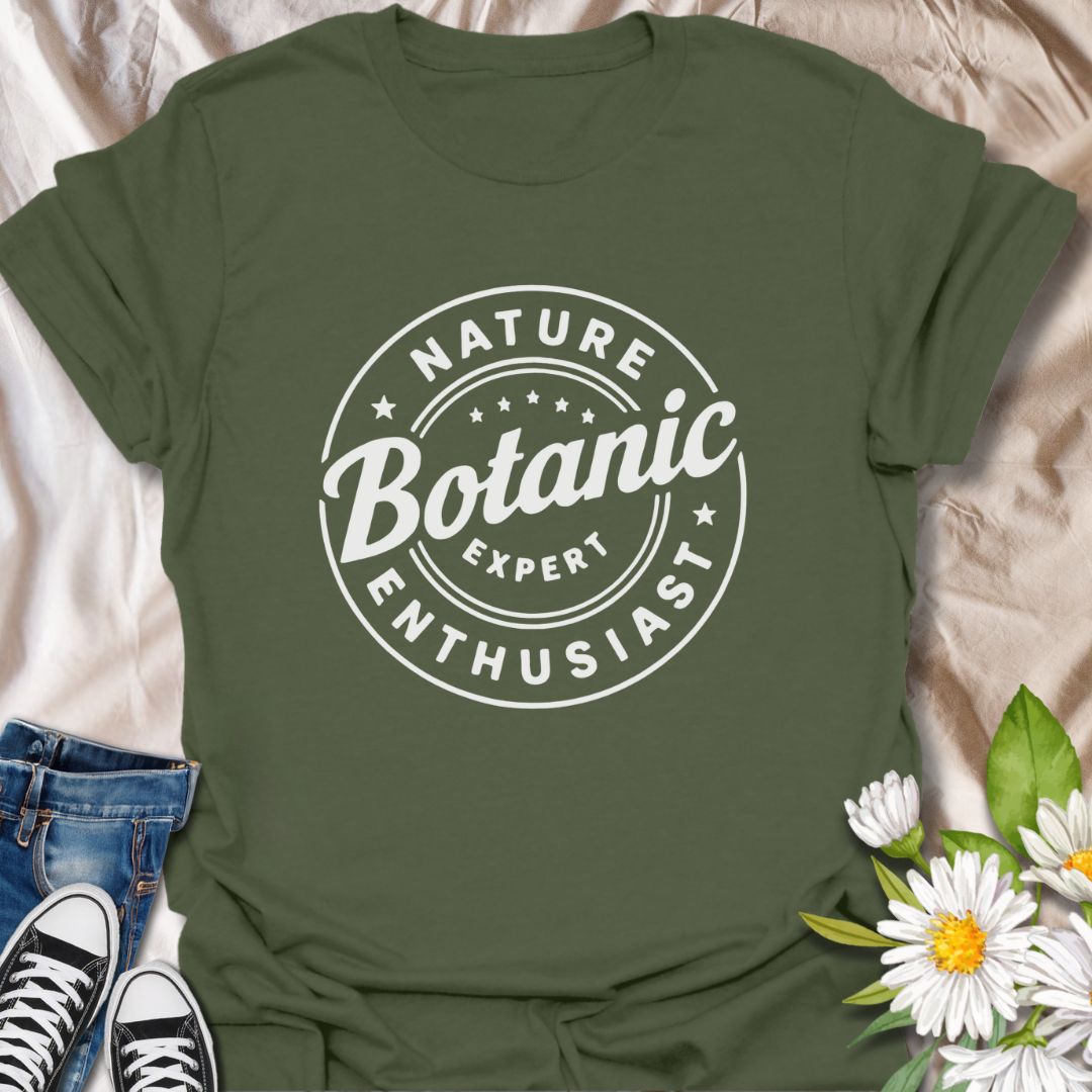 Show off your love for plants with this bold graphic t-shirt featuring the phrase "Nature Expert Botanic Enthusiast." This is in either white or black text, dependant on the color choice. This Tee is Perfect for gardeners, plant parents, and anyone passionate about botany, nature, and green living.