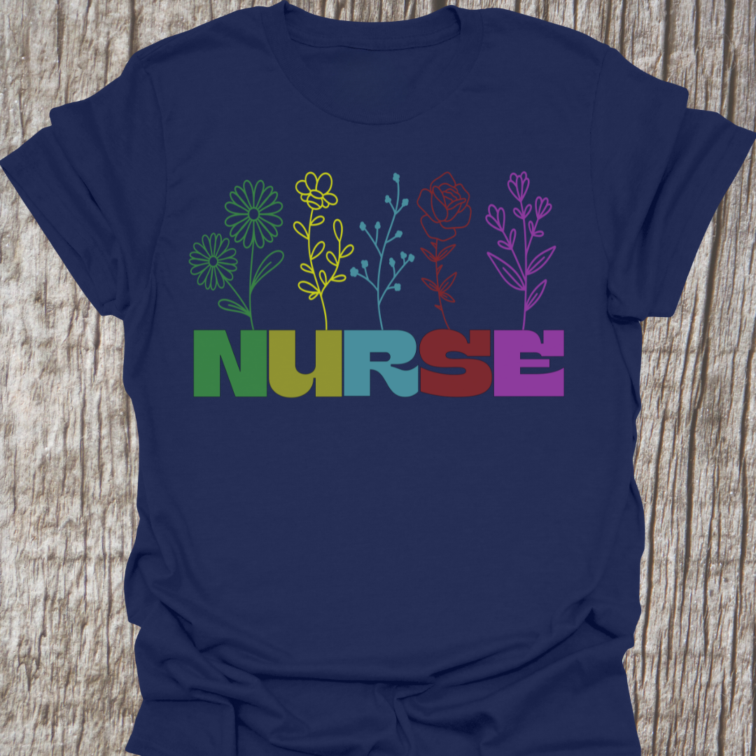 Beautiful Nurse t-shirt with the word NURSE each letter being a different color, with a flower attached to the letter in same color, on a navy blue t-shirt