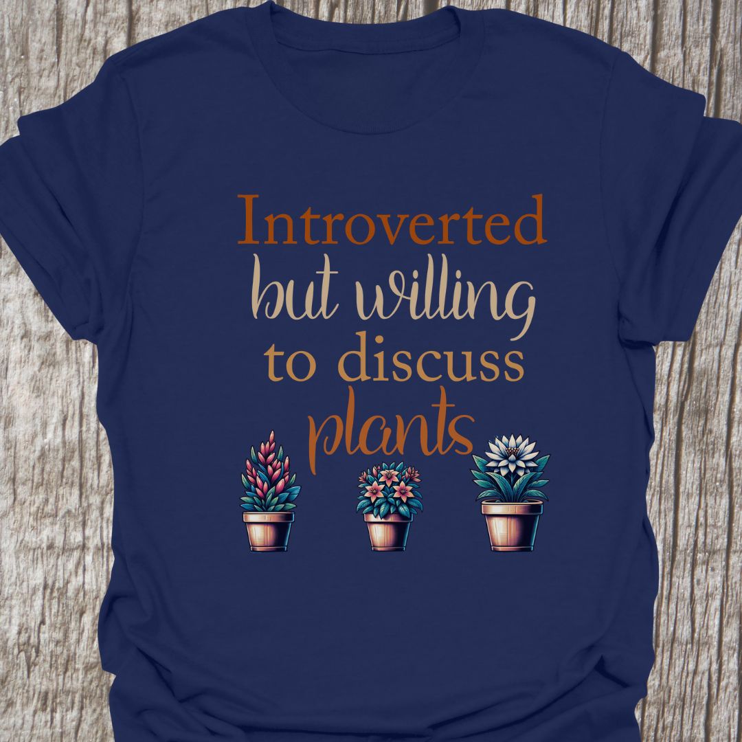 Introverted but willing to discuss plants in natural colored text with image of three flowering pot plants, on a navy blue t-shirt