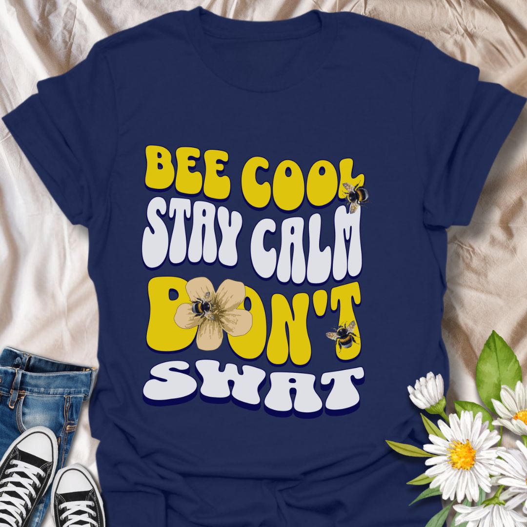 Playful bee-themed t-shirt with "Bee Cool Stay Calm Don't Swat" design. Fun gift for bee lovers, pollinator enthusiasts, and anyone who appreciates a lighthearted garden vibe. Navy