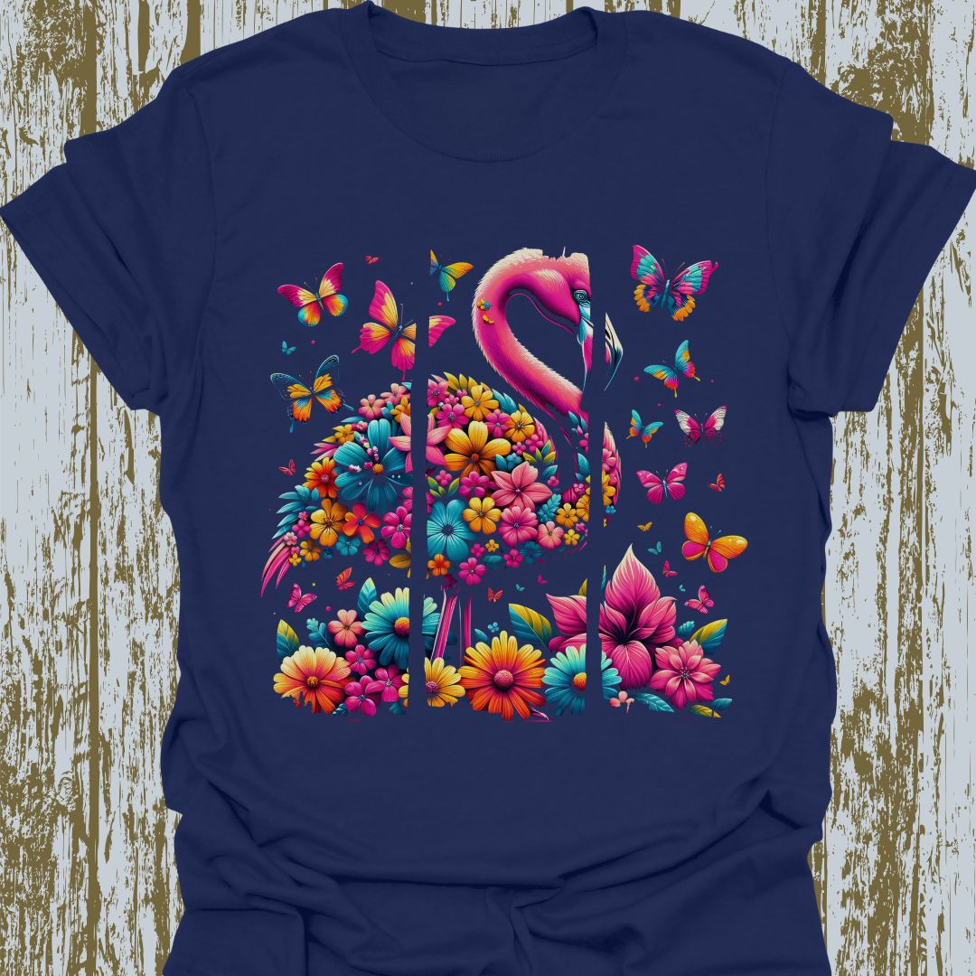 A design featuring flamingos, butterflies, and flowers in pink, yellow, and blue hues on navy blue t-shirt.