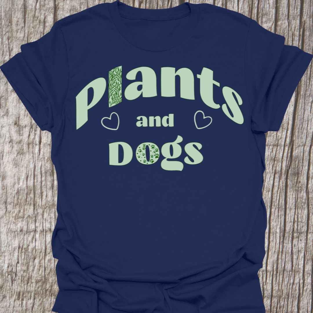 Plants and Dogs in text with subtle paw prints and leaves within the text design, decorated with two small hearts. Light green on a navy blue t-shirt