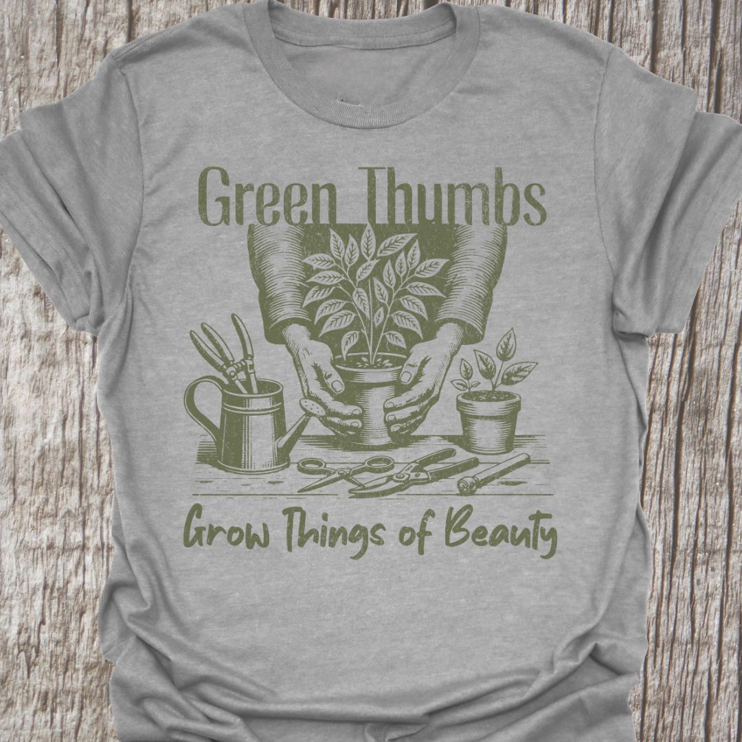 Green Thumbs Grow Things of Beauty text with image of hands holding a plant pot and garden implements around on a sport grey t-shirt