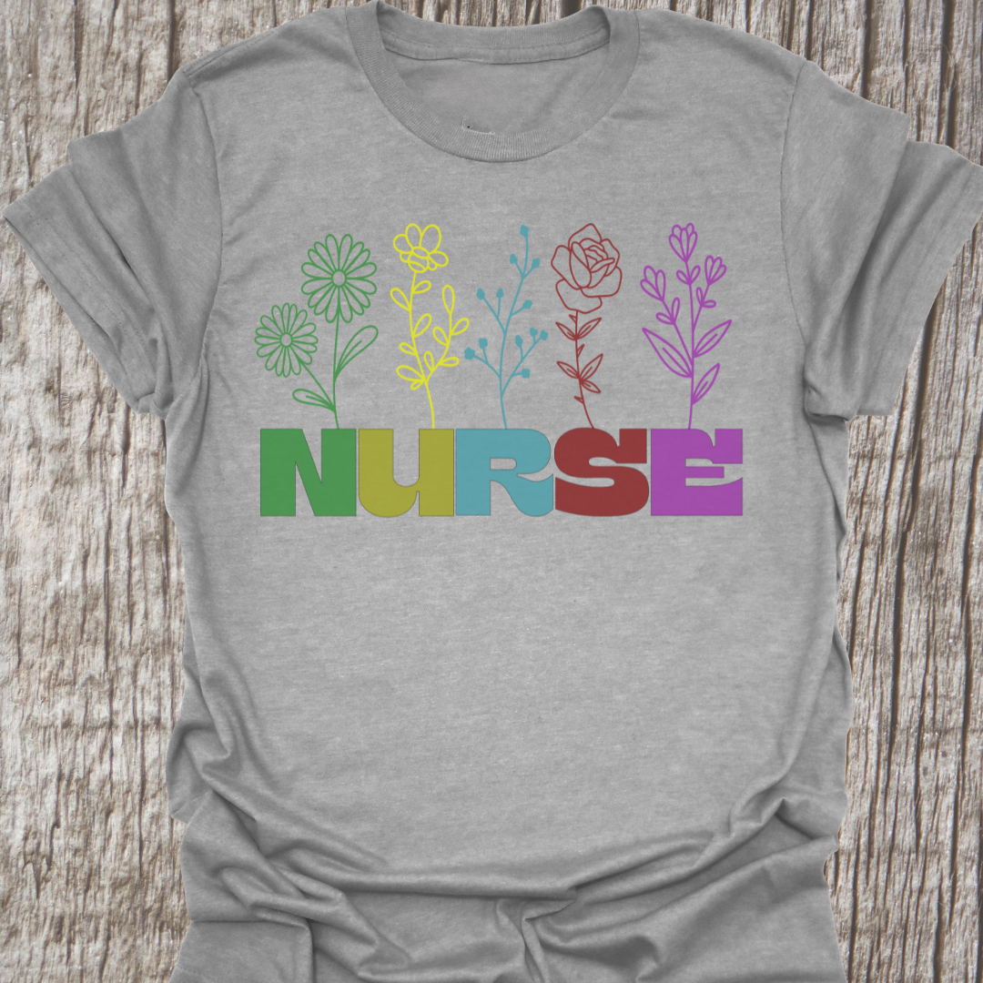 Beautiful Nurse t-shirt with the word NURSE each letter being a different color, with a flower attached to the letter in same color, on a sport grey t-shirt