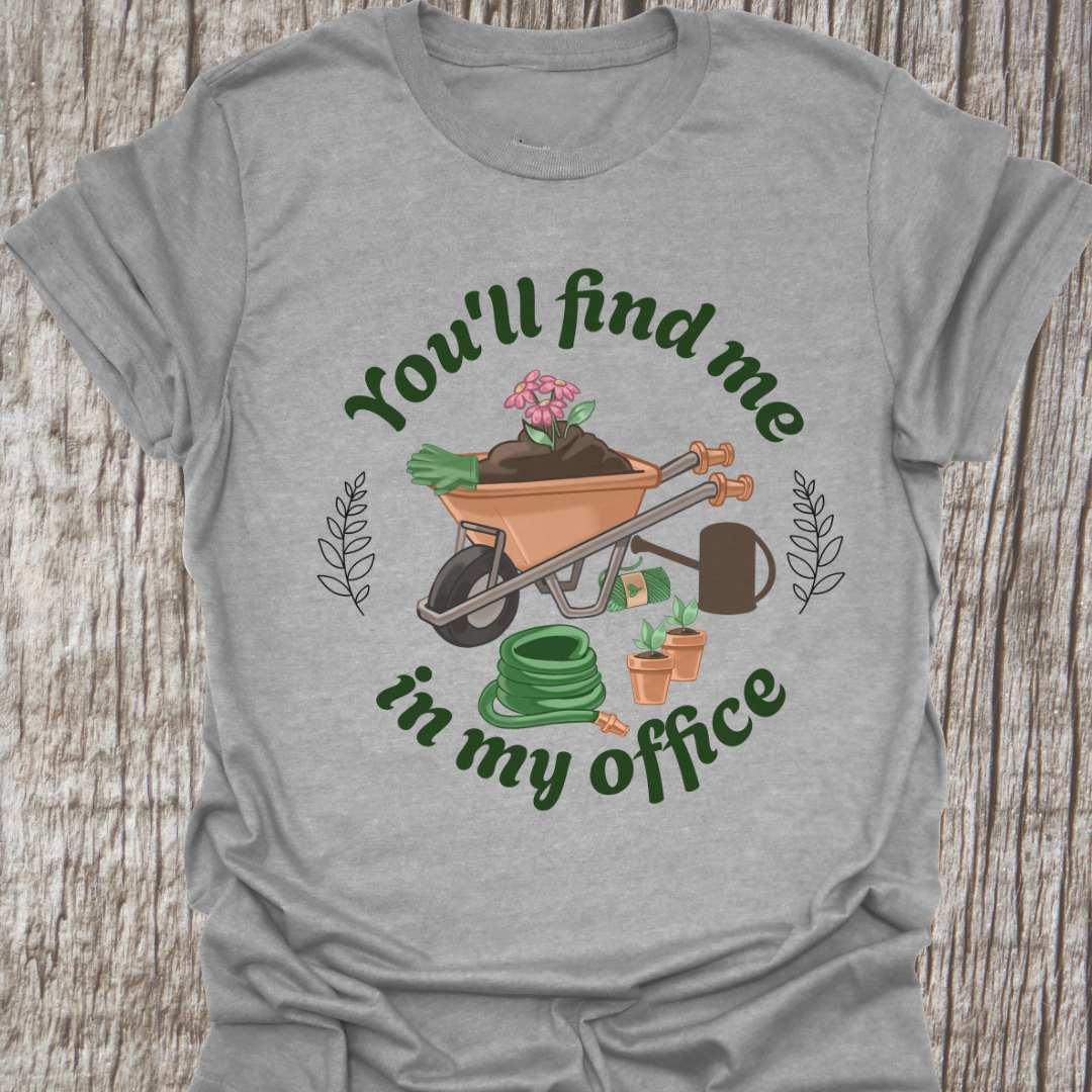 circular text 'You'll find me in my office' with wheelbarrow, hose, plants and watering can within circle all text in green on sport grey t-shirt