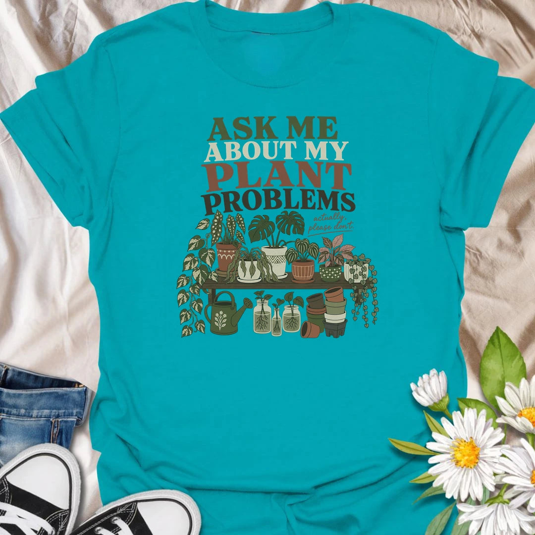 Invite a very long conversation with this “Ask Me About My Plant Problems” T-shirt. Featuring a collection of thriving, trailing, and slightly dramatic houseplants, it is ideal for plant parents who always have a care story to share. A funny botanical gift for houseplant collectors and indoor gardeners.