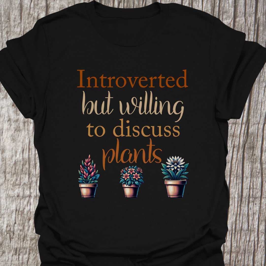 Introverted but willing to discuss plants in natural colored text with image of three flowering pot plants, on a black t-shirt