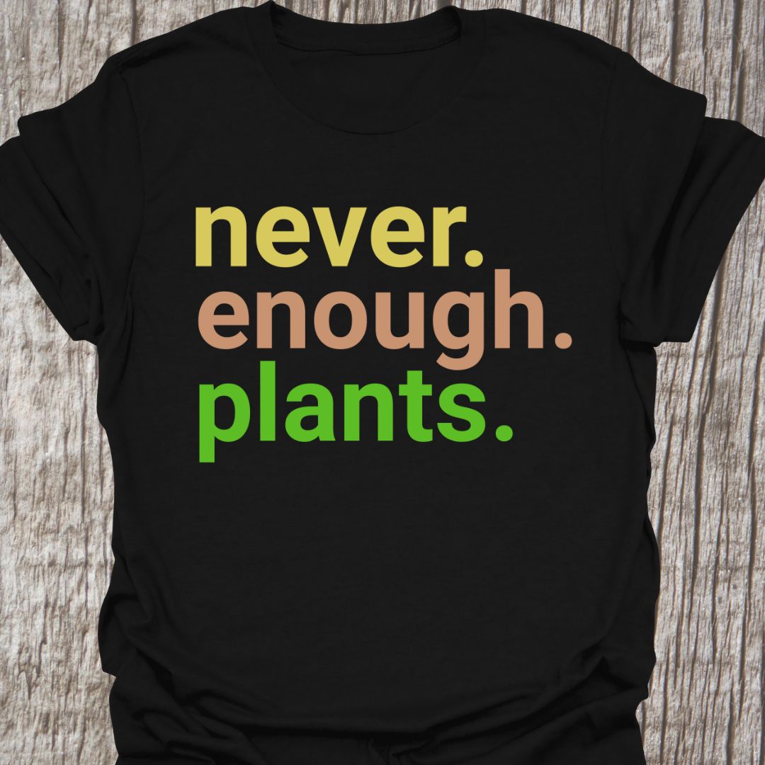 Text based design stating 'never enough plants' over three lines. Written in three colors on a black t-shirt
