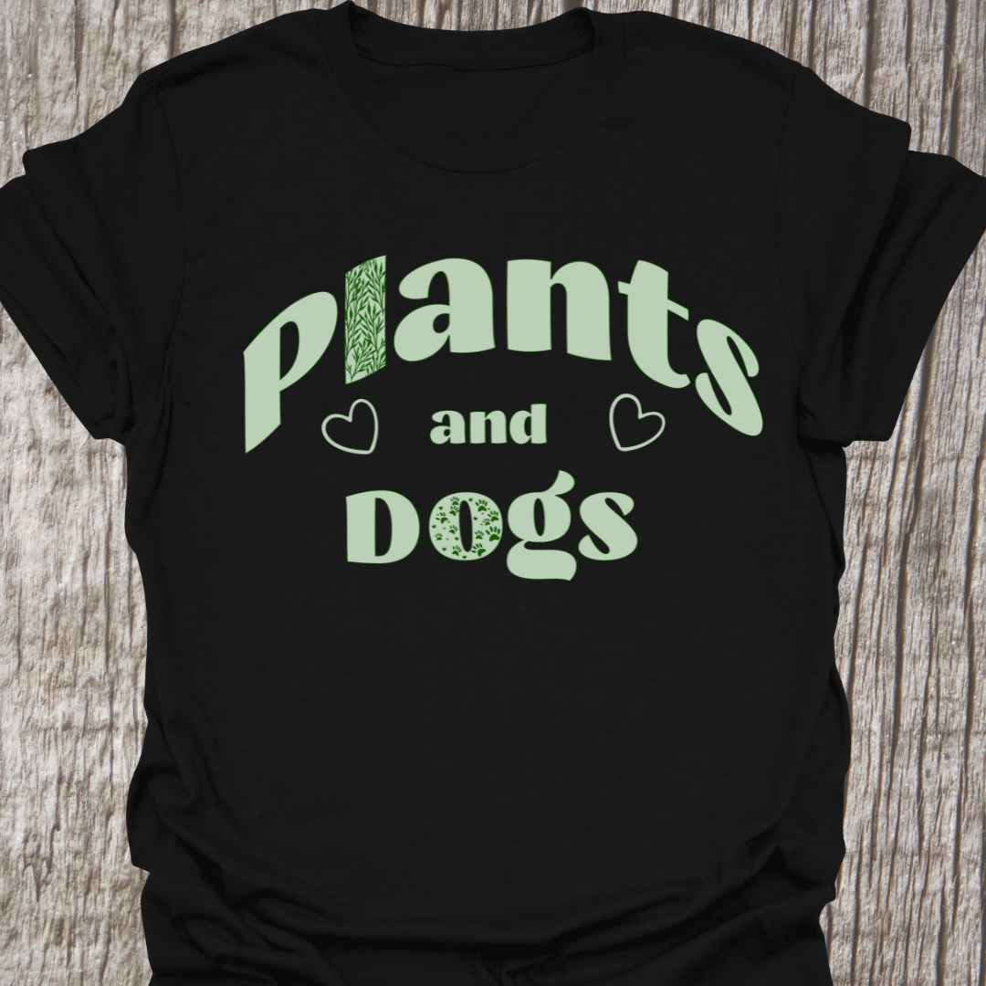 Plants and Dogs in text with subtle paw prints and leaves within the text design, decorated with two small hearts. Light green on a black t-shirt