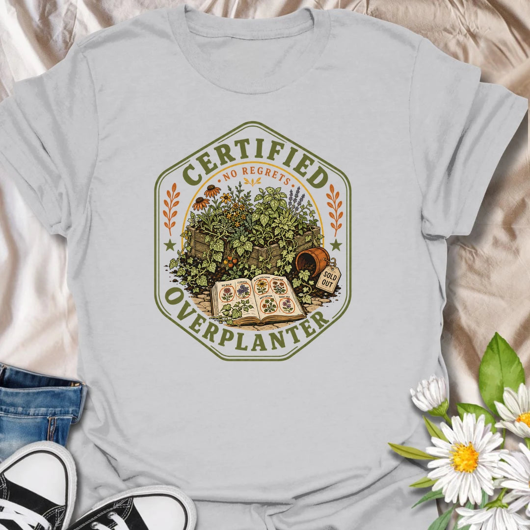 This Certified Overplanter t-shirt is made for gardeners who know there is always room for just one more seedling, even when the garden is already overflowing. Featuring a vintage badge-style design with crowded garden beds, seed packets, an open seed catalog, a sold out pot, and the phrase No Regrets, this tee has a funny plant-lover feel with classic garden-club charm. Perfect for gardeners, plant lovers, backyard growers, flower fans, vegetable gardeners, and anyone who proudly overplants every season.