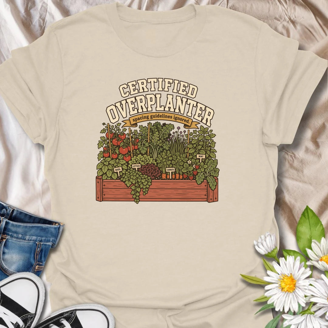 Celebrate an overflowing vegetable garden with this “Certified Overplanter” T-shirt. The detailed raised-bed design features tomatoes, carrots, lettuce, basil, mint, strawberries, and the perfect lack of spacing. It is a funny gift for ambitious gardeners who always squeeze in one more plant.