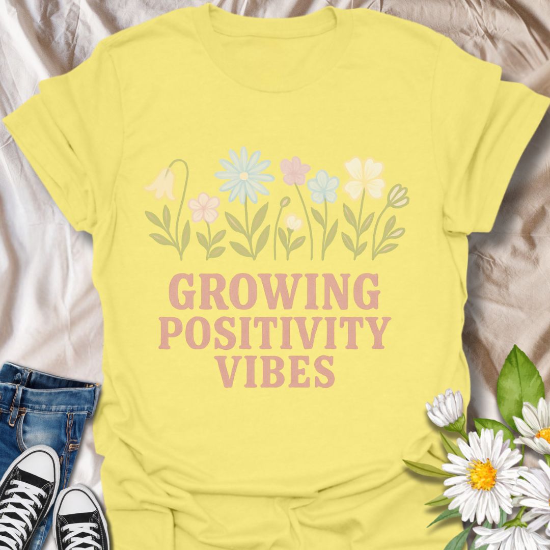 Radiate good energy with this “Growing Positivity Vibes” t-shirt featuring pastel wildflowers on a cornsilk yellow tee. A perfect uplifting gift for plant lovers, garden enthusiasts, and anyone who embraces a cheerful, kind-hearted lifestyle.