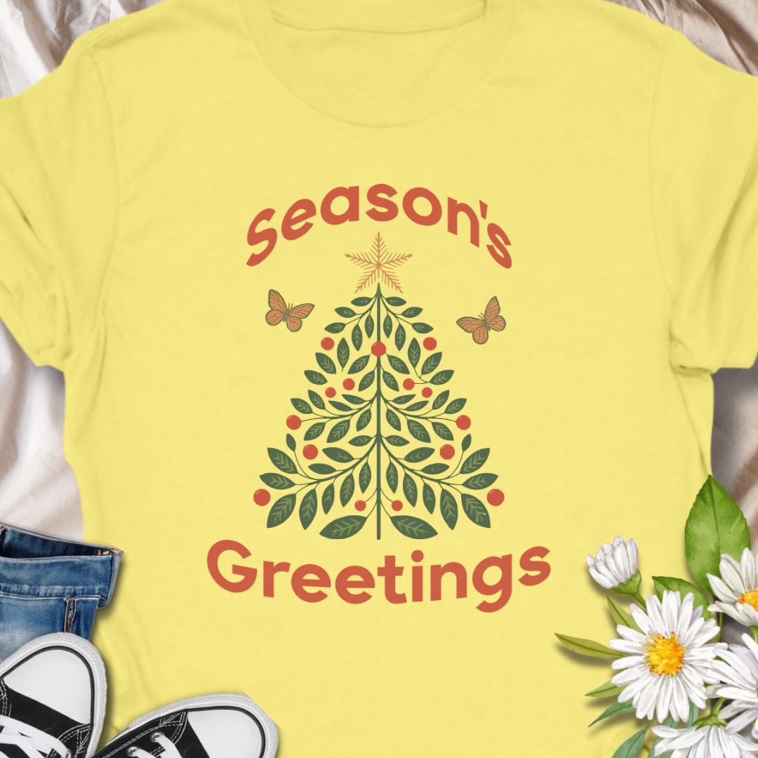 Spread festive cheer with this charming “Season’s Greetings” t-shirt featuring a leafy Christmas tree and butterflies. A unique and nature-inspired holiday tee perfect for garden lovers and anyone who celebrates the season in style.