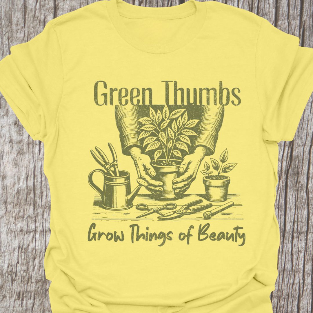 Green Thumbs Grow Things of Beauty text with image of hands holding a plant pot and garden implements around on a cornsilk t-shirt