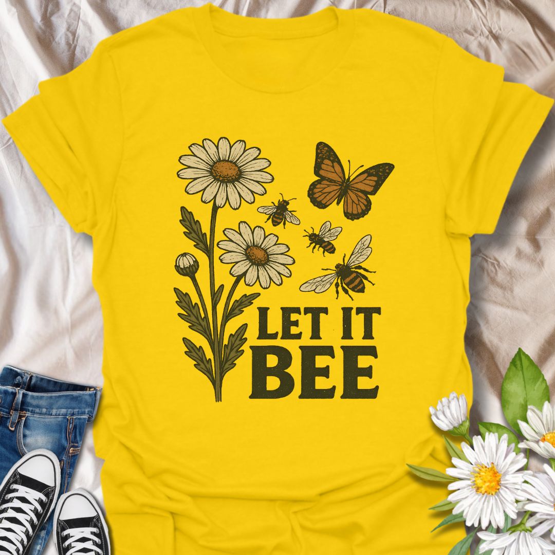 Spread a positive eco-friendly message with this charming graphic t-shirt featuring daisies, bees, a butterfly, and the playful phrase "Let It Bee." Perfect for pollinator supporters, nature lovers, and anyone who enjoys whimsical botanical-themed apparel.