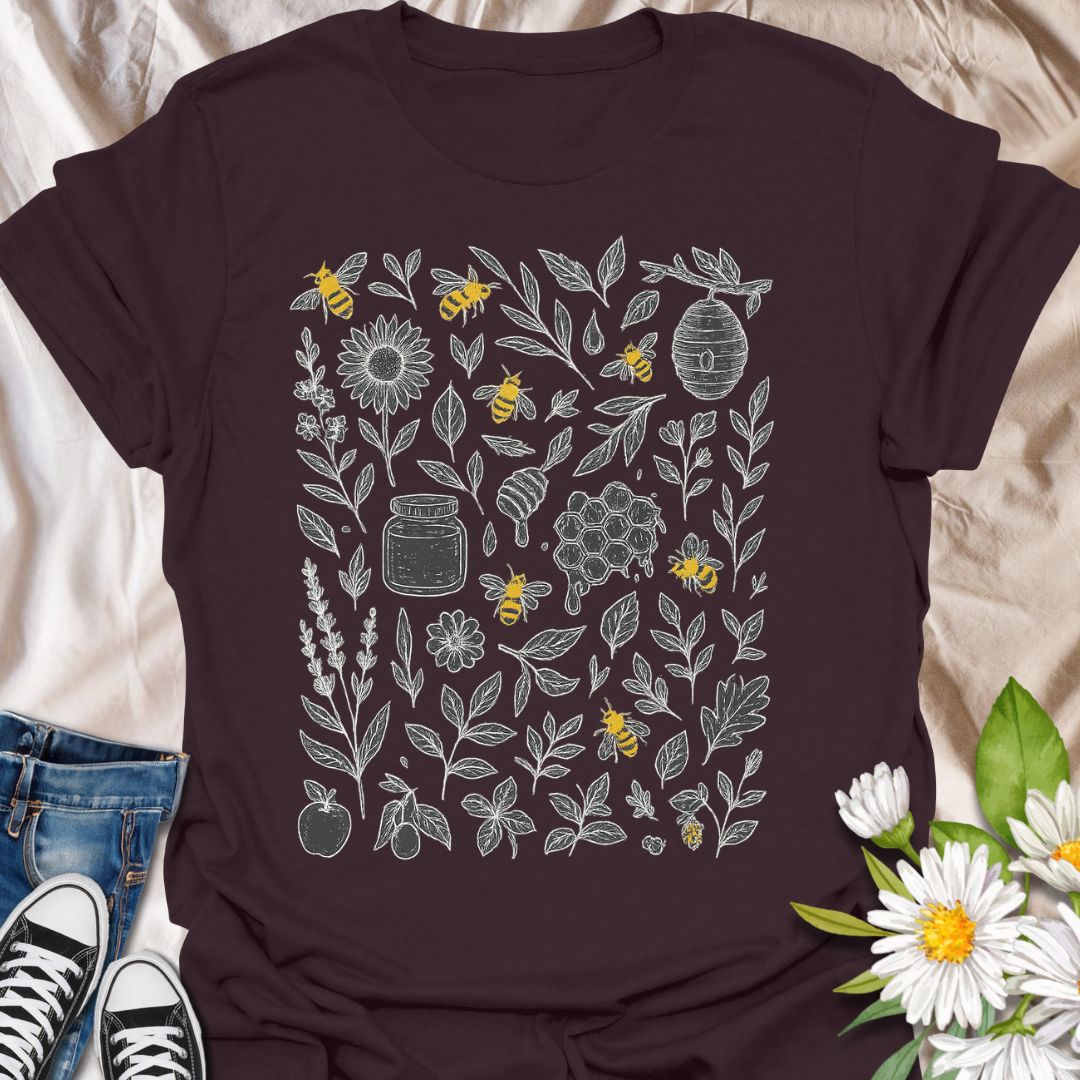Celebrate nature and pollinator protection with this beautifully detailed t-shirt featuring hand-drawn floral illustrations and buzzing bees. A perfect choice for eco-conscious fashion lovers, gardeners, and bee conservation supporters who enjoy botanical and nature-inspired designs.