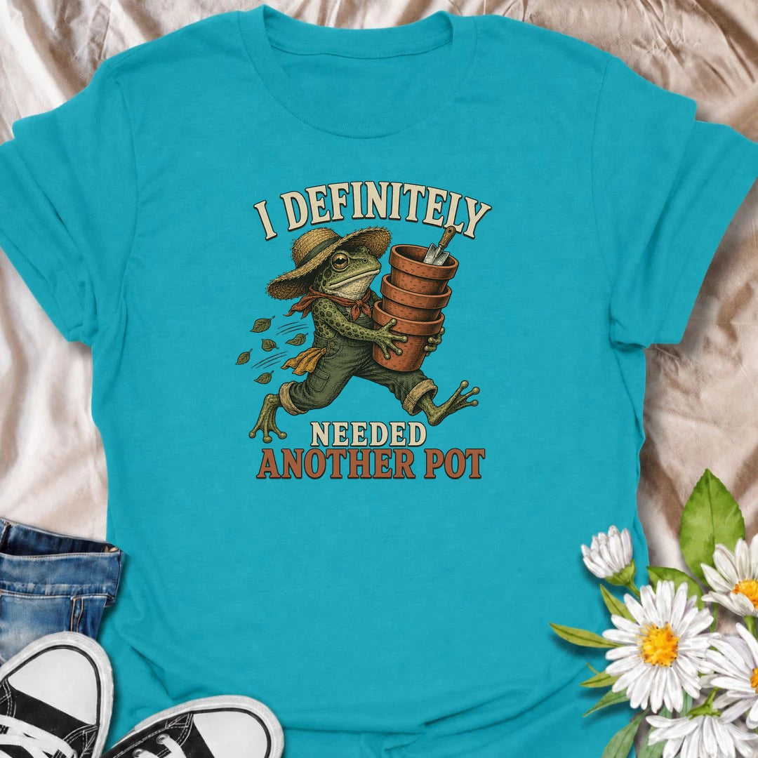 A funny gardening T-shirt for anyone who can always justify bringing home another plant pot. Featuring a determined vintage-style frog carrying a stack of terracotta pots, this design is perfect for gardeners, plant parents, and nursery regulars. The phrase “I Definitely Needed Another Pot” captures the familiar habit of collecting planters almost as quickly as plants. It makes a great gift for houseplant lovers, container gardeners, and anyone who never leaves the garden center empty-handed. Ideal for nurs