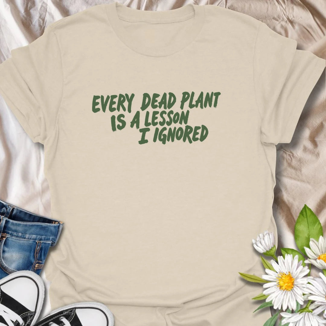 Funny plant t-shirt for anyone whose dead plants were definitely lessons… just not lessons they followed.
Features bold text-only styling with a relatable houseplant humor message for plant lovers and plant parents.
Perfect for houseplant owners, beginner gardeners, and anyone who laughs through the plant struggle.