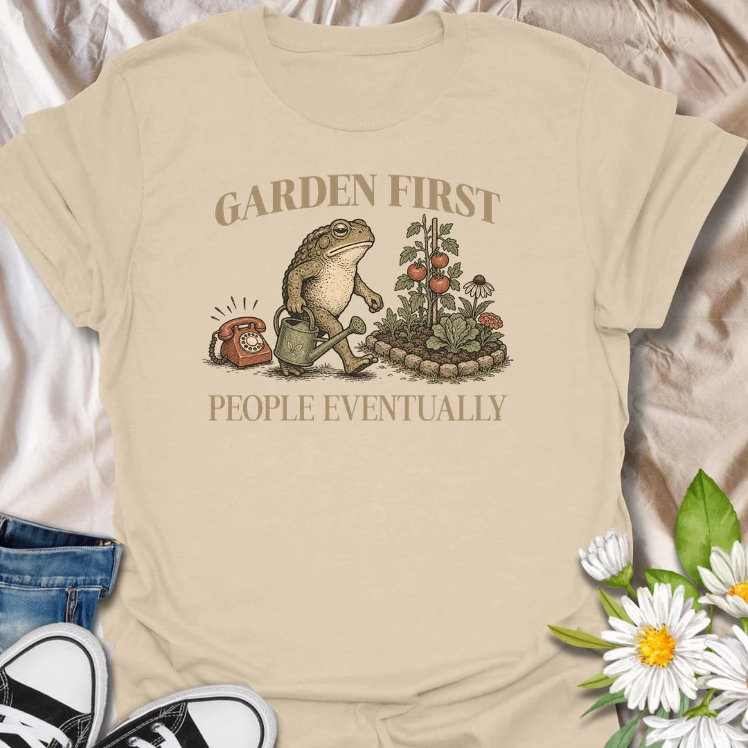 This Garden First People Eventually t-shirt is perfect for gardeners who’d rather be outside with flowers, plants, and pollinators than socializing. Featuring a charming vintage-style garden scene with a hedgehog, snail, and blooming flowers, this botanical tee is ideal for plant lovers, cottage garden fans, backyard gardeners, and anyone with a funny garden-first attitude.
