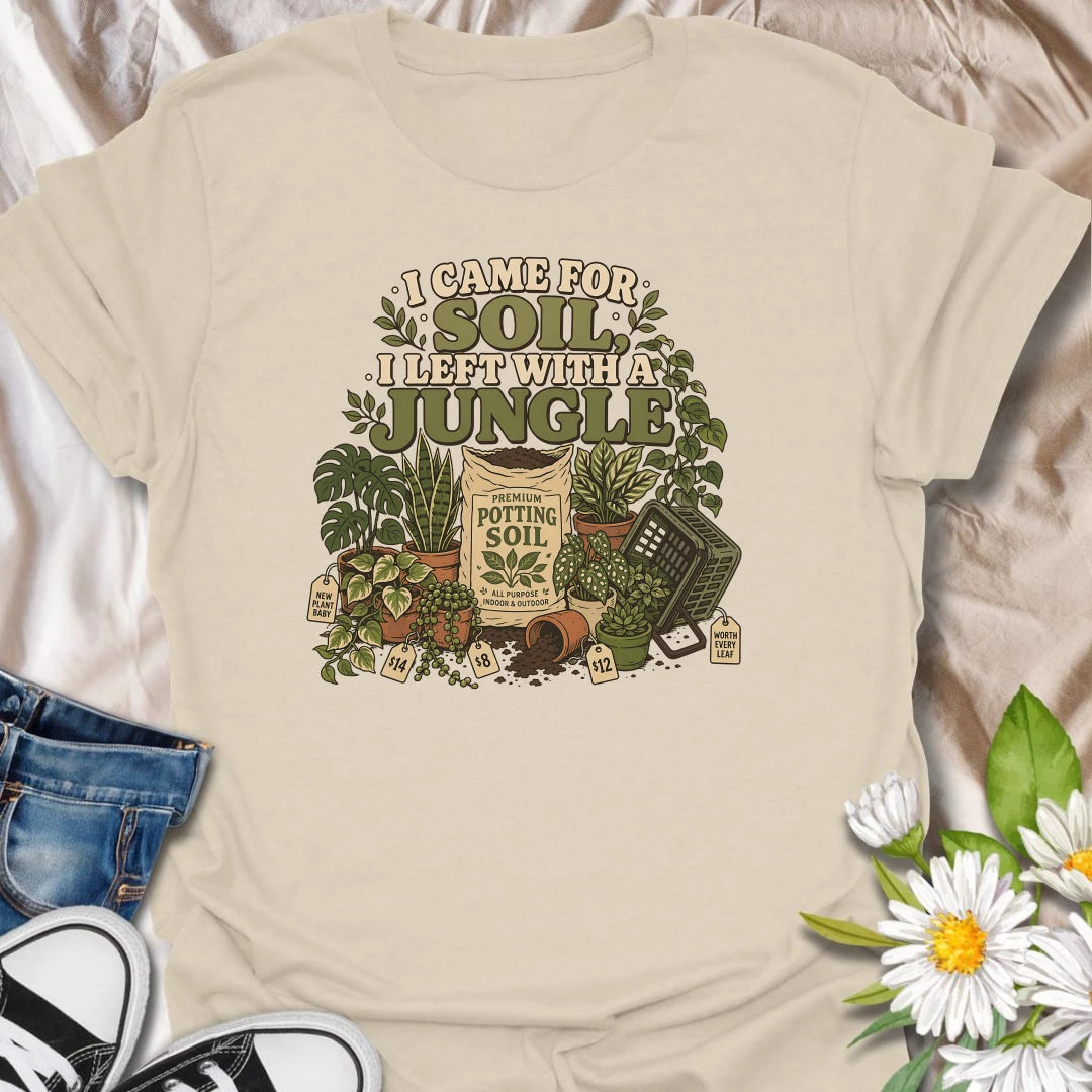 Celebrate an accidental plant haul with this “I Came for Soil, I Left With a Jungle” T-shirt. Featuring a bag of potting soil surrounded by lush houseplants and price tags, it is perfect for devoted plant shoppers. A funny gift for anyone whose quick nursery visit becomes a full indoor jungle.