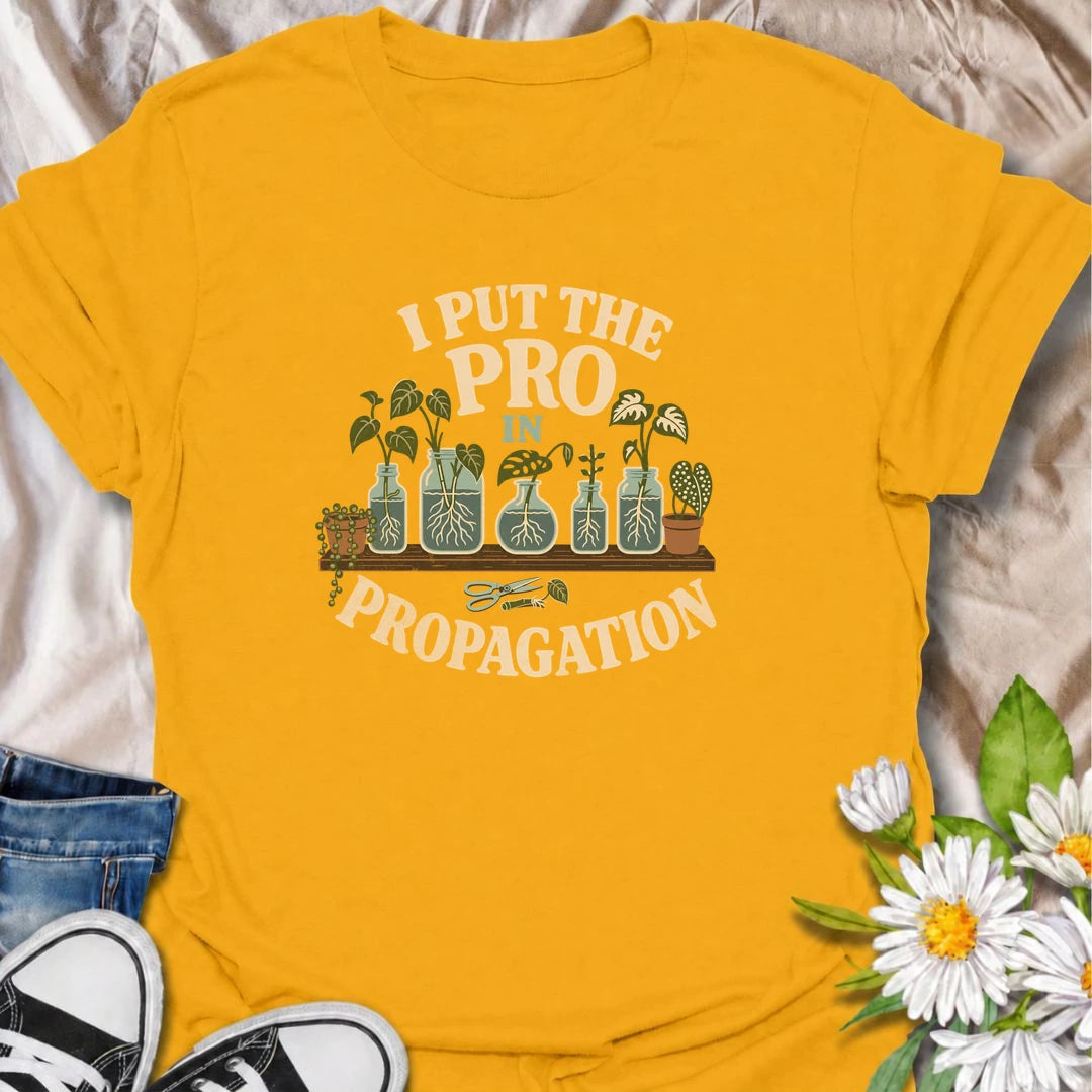 A funny propagation T-shirt for houseplant lovers who have turned rooting cuttings into a full-time hobby. Featuring plant cuttings growing in water-filled jars, this design is made for pothos fans, plant parents, and indoor gardeners. The playful “I Put the Pro in Propagation” phrase makes it a great gift for anyone with a growing collection of propagated plants. Perfect for plant swaps, nursery trips, greenhouse days, or simply showing off your houseplant obsession. A fun botanical graphic tee for anyone