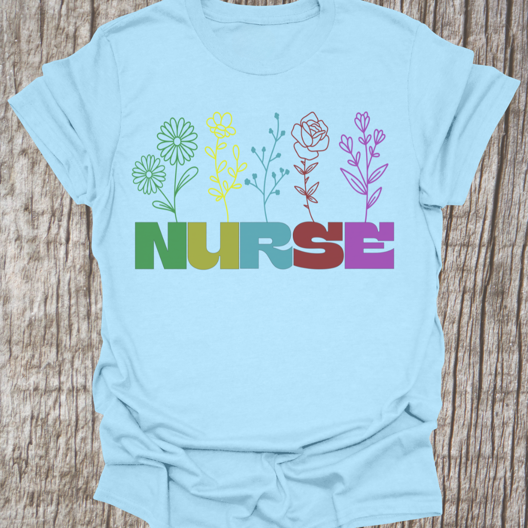 Beautiful Nurse t-shirt with the word NURSE each letter being a different color, with a flower attached to the letter in same color, on a light blue t-shirt