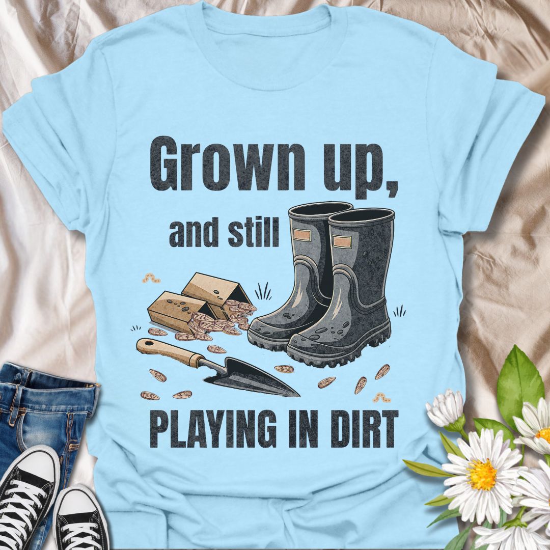 Playfully nostalgic gardening shirt with boots, seeds, and trowel artwork. Ideal for grown-up gardeners who still love getting their hands dirty. A perfect gift for plant lovers with a sense of humor.