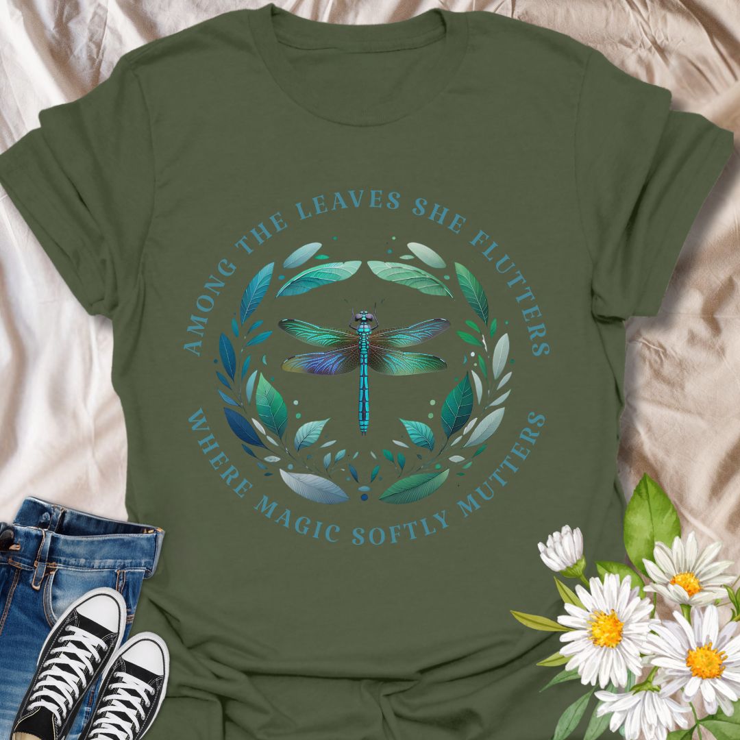 Mystical dragonfly t-shirt with detailed wings and a leafy circle, wrapped in the phrase “Among the leaves she flutters, where magic softly mutters.” A magical nature design for dreamers, woodland lovers, and poetic souls.
