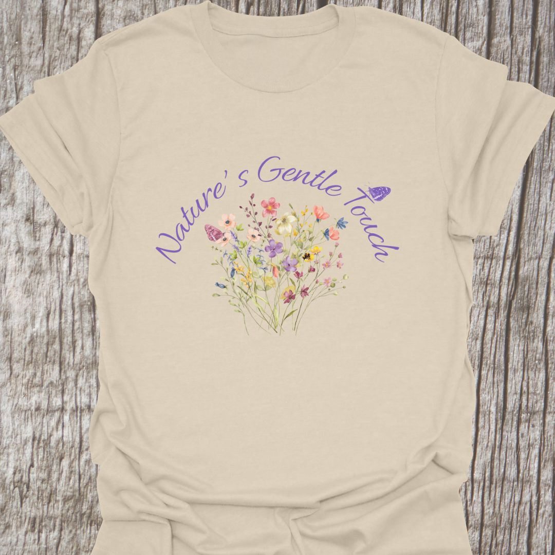 Beautiful flowers natural colored T-shirt, 'Nature's Gentle Touch' curving around flowers in a lilac font, and a butterfly gently resting within the design.
