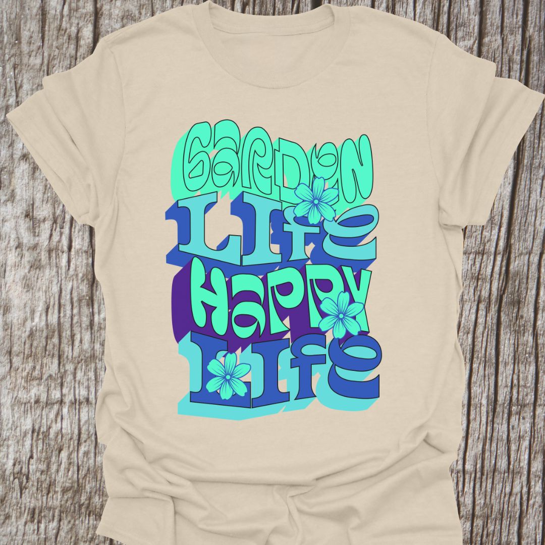 Garden Life, Happy Life written in green and blue alternate text with small flowers as decoration, on a natural color t-shirt